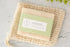 Handmade natural lemongrass soap bar on a jute soap bag, vegan and chemical-free, perfect for nourishing skin.