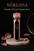 Premium Nérlissa LED skin rejuvenation device on a marble pedestal with rose petals.