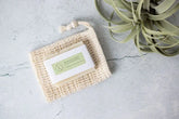 Soul Touch Massaging Set on natural burlap mat, showcasing eco-friendly packaging and calming plant decor.