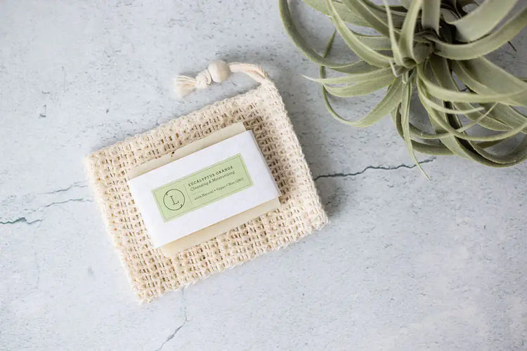 Soul Touch Massaging Set on natural burlap mat, showcasing eco-friendly packaging and calming plant decor.