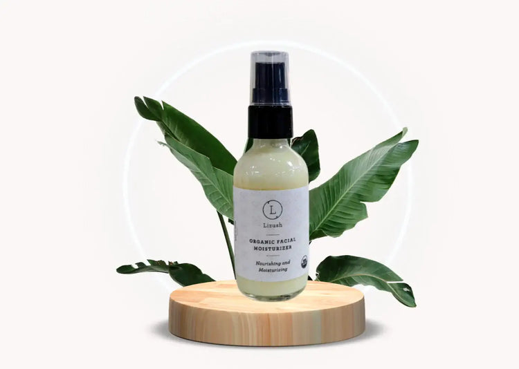 Organic facial moisturizer bottle on wooden pedestal surrounded by green leaves, promoting natural skincare.