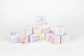 Colorful lavender bath cubes stacked for a soothing bath experience.