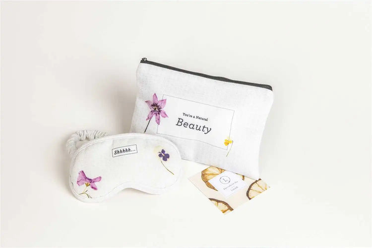 Lavender eye mask and beauty pouch in a luxury gift box, perfect for self-care and relaxation.