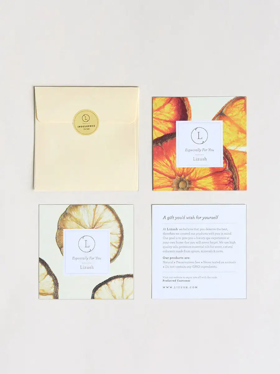 Greeting cards and envelope featuring dried orange slices and elegant design for gifting.
