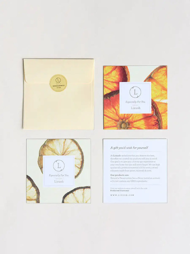 Greeting cards and envelope featuring dried orange slices and elegant design for gifting.