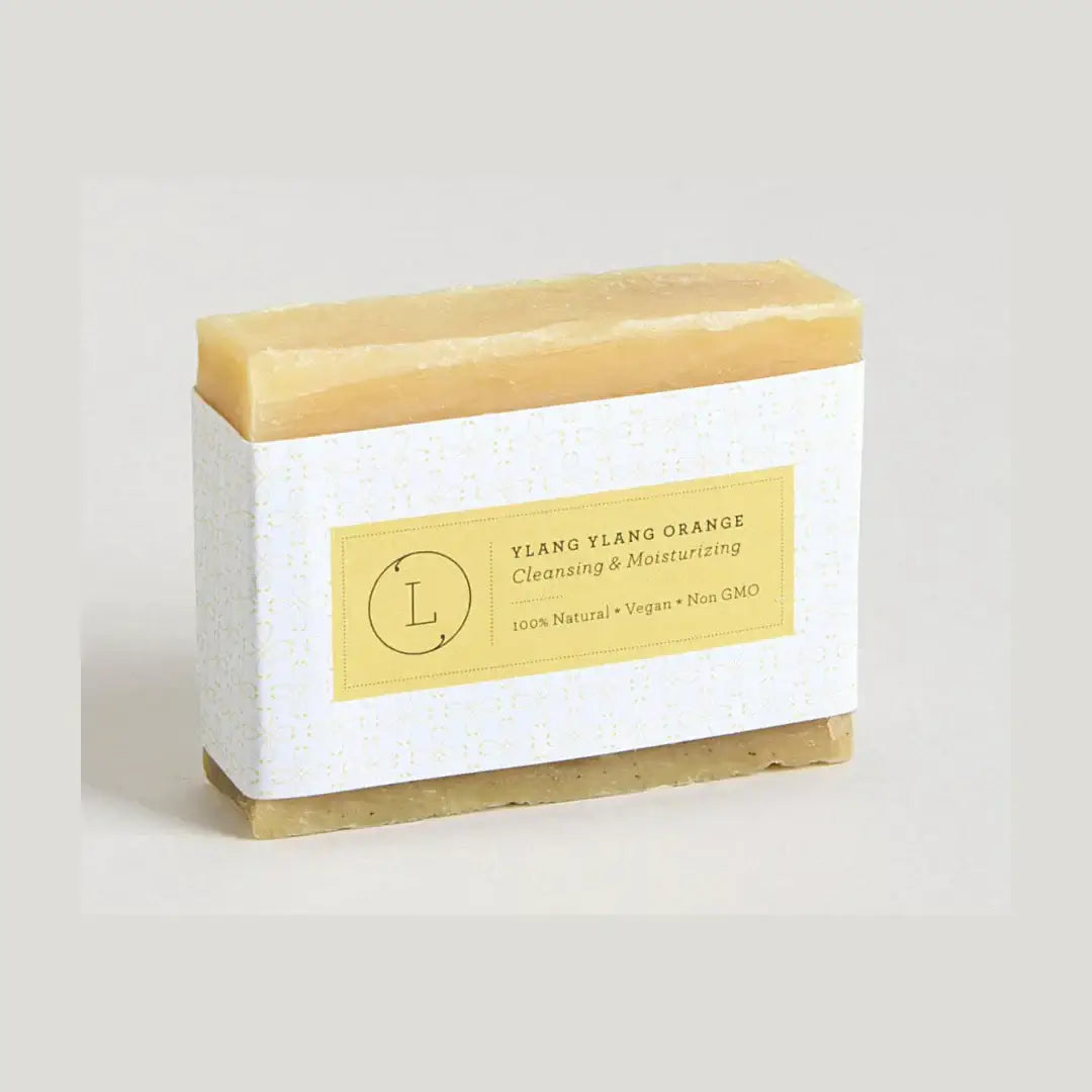 Ylang Ylang Orange Natural Soap Bar in eco-friendly packaging, 100% natural, vegan, and non-GMO.