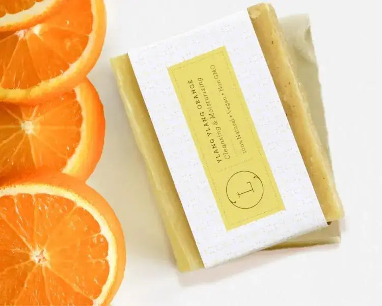 Yalng Yalng Orange Natural Soap Bar with fresh orange slices, handcrafted skincare infused with love.